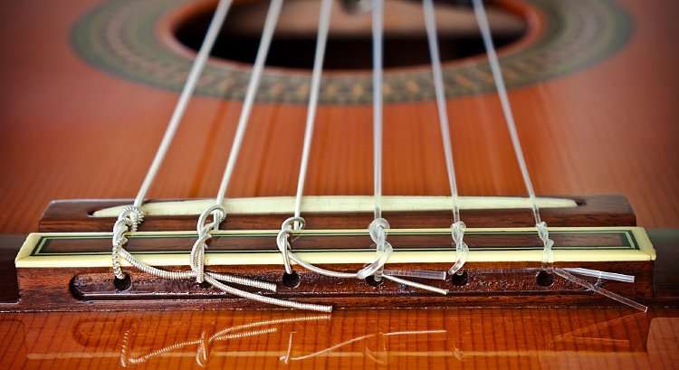 Acoustic guitar string height