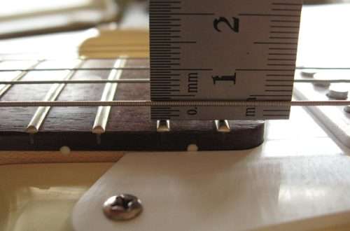 Acoustic guitar string height